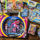 A large collection of various boxes and packs of Pokemon TCG cards.